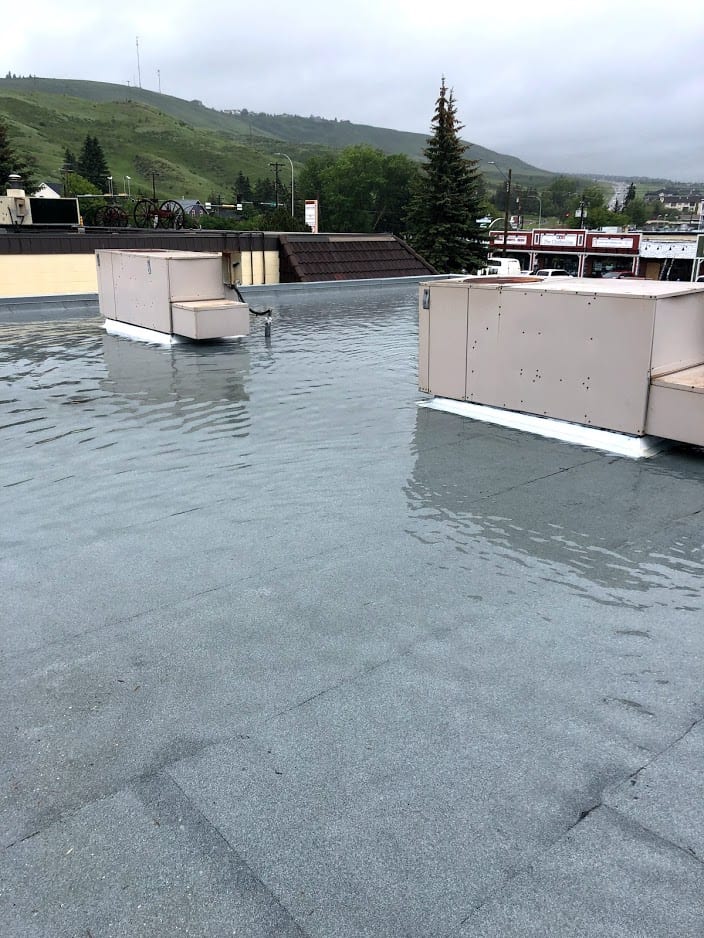 Roof in chocrane that flooded from improper drainage