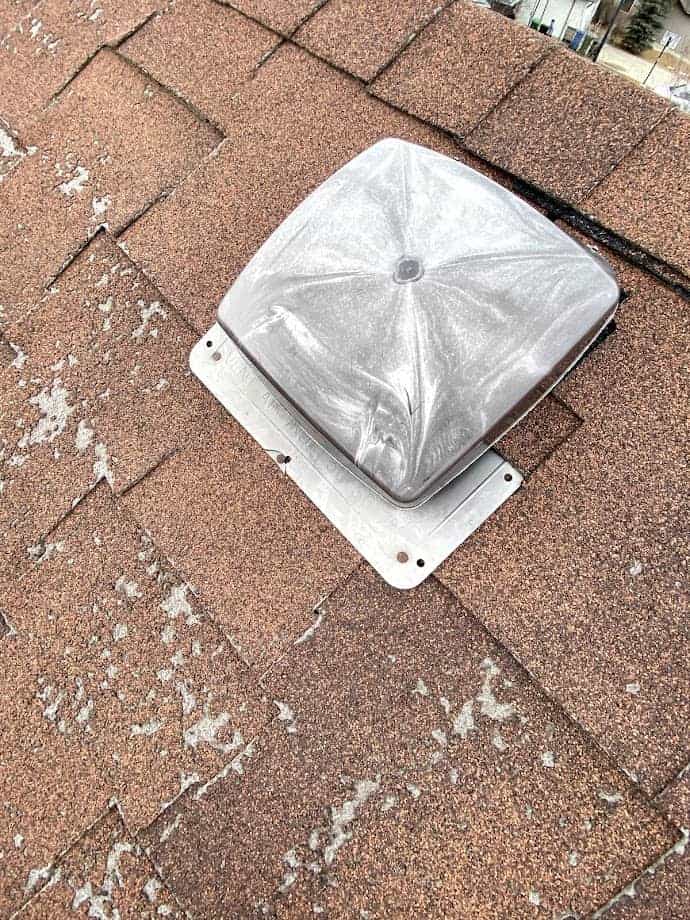 A Damaged roof vent that needs to be replaced