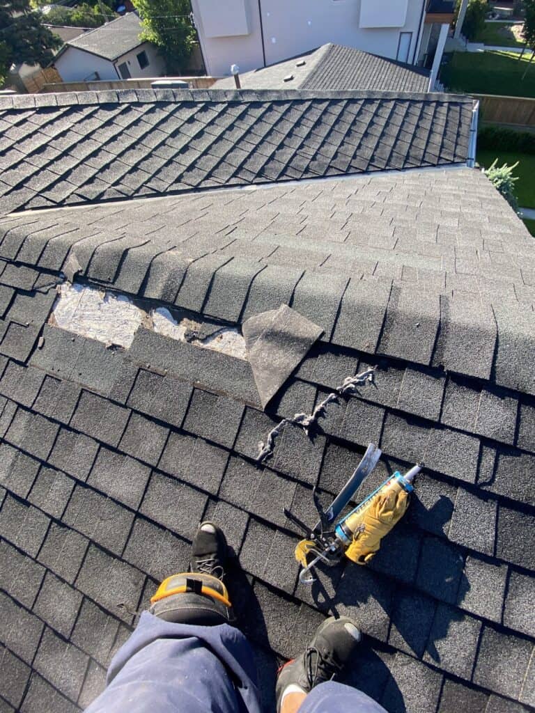 A W4SR Employee about to repair a broken roof shingle